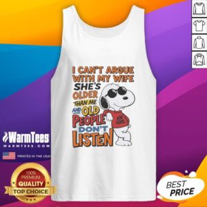 Retired husband wearing a tank top with humorous text about not arguing with his older wife, showcasing playful relationship.