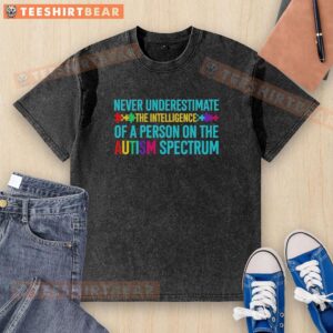 Alt Text: Person wearing a 'Never Underestimate The Intelligence Of A Person On The Autism Spectrum' washed t-shirt.