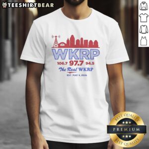 Alt Text: Retro T-shirt featuring WKRP 106.7, 97.7, and 94.5 with city skyline, celebrating The Real WKRP since May 4, 2026.