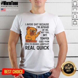 Pretty angry pug in an orange jumpsuit t-shirt, showcasing its playful yet feisty personality with vibrant colors.