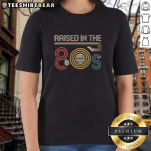 Stylish 'I Was Raised In The 80s' ladies tee featuring retro graphics, perfect for 80s nostalgia fans.