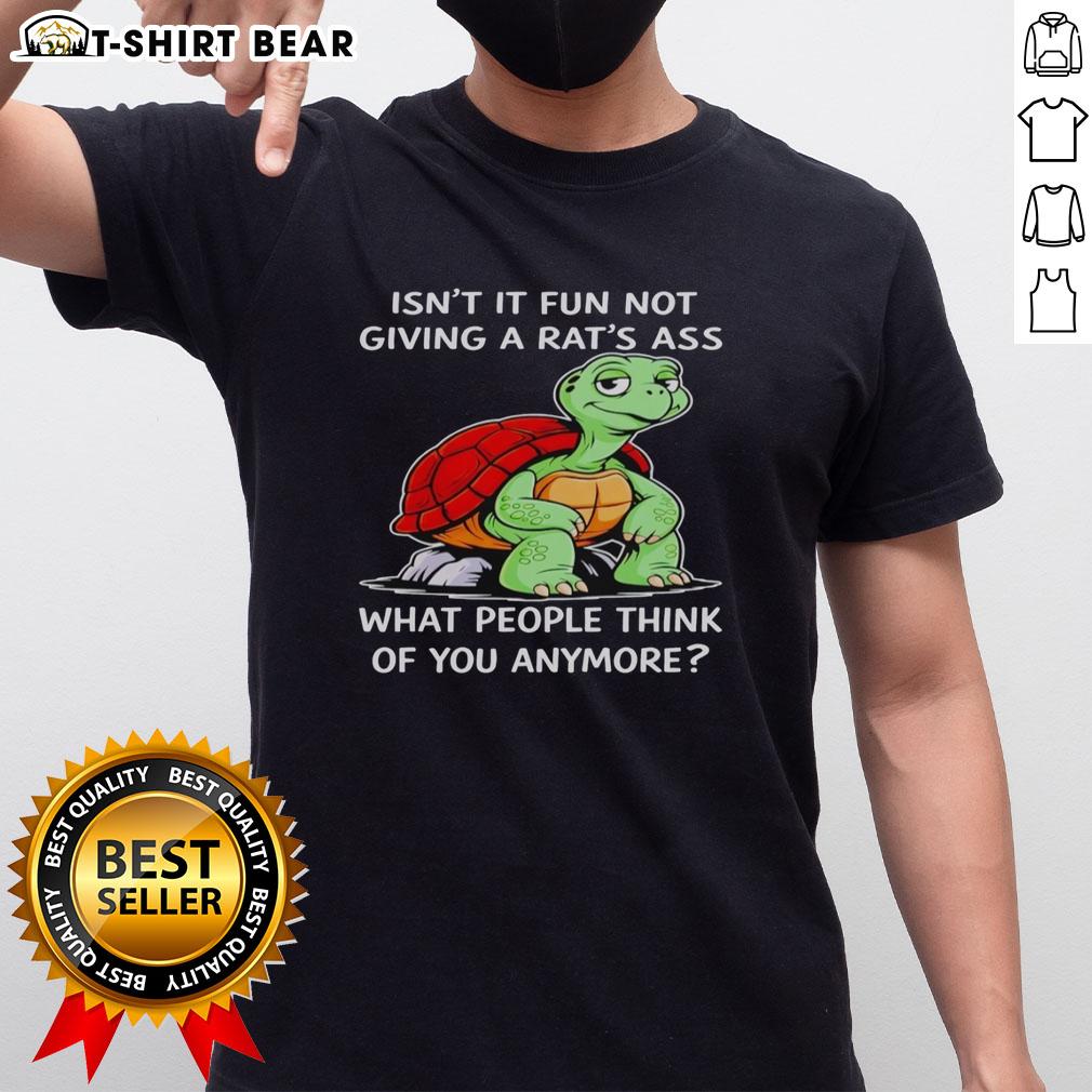 Top Turtle Isn't It Fun Not Giving A Rat's Ass What People Think Of You Anymore T-Shirt Top Turtle 'Isn't It Fun Not Giving A Rat's Ass' T-Shirt design with a humorous message about self-acceptance and confidence.