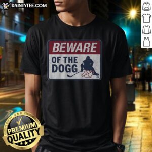 Hot Nathan Mackinnon Beware Of The Dogg T-Shirt featuring vibrant graphics and bold text, perfect for hockey fans.