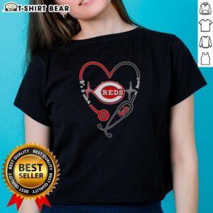 Top Cincinnati Reds Stethoscope Heartbeat design on a ladies tee, perfect for fans and healthcare professionals.