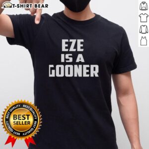 Top Arsenal FC Eze Is A Gooner T-Shirt featuring bold text and vibrant colors, perfect for Arsenal fans.