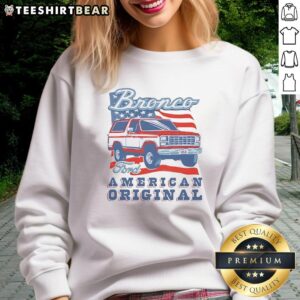 Vintage sweatshirt featuring Awesome Ford Bronco design with American flag, perfect for car enthusiasts and retro style lovers.