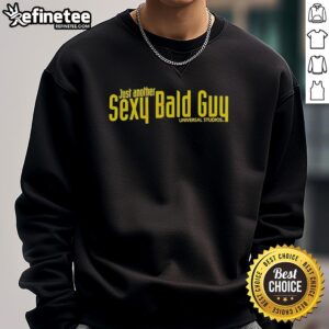 Hot bald guy wearing a sexy Universal Studios sweatshirt, showcasing style and comfort at a theme park.