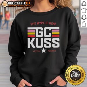 Alt Text: Sepp Kuss wearing a stylish Jumbo Visma sweatshirt featuring the Good Gc Kuss La Machine logo during a cycling event.