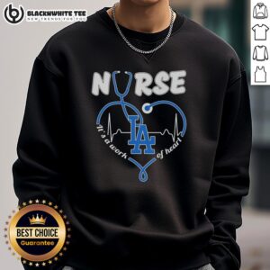 Cozy Los Angeles Dodgers sweatshirt with 'It's a Work of Heart' design, perfect for fans and nurses alike.