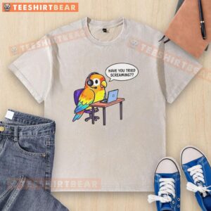 Graphic design on a washed t-shirt with the phrase 'Have You Tried Screaming' in bold colors, perfect for casual wear.