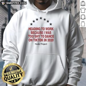 Person wearing a Seven Stars hoodie, heading to work, reflecting on shyness about dancing on TikTok in 2020.