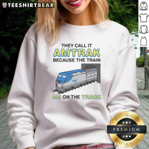 Alt Text: Cozy 'Nice They Call It Name Because The Train Am On The Track' sweatshirt in a stylish casual setting.