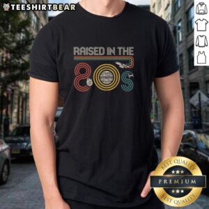 Top I Was Raised In The 80S T-Shirt featuring retro design and vibrant colors, perfect for nostalgic 80s fashion lovers.