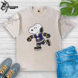 Alt Text: Official Snoopy wearing a Buffalo Sabres ice hockey jersey on a stylish washed t-shirt, perfect for fans.