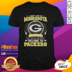 Alt Text: Green Bay Packers NFL t-shirt with 'I May Live In Minnesota On Sundays My Heart And Soul Belong To Packers' slogan.