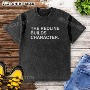 Nice The Redline Builds Character washed t-shirt displayed on a wooden surface, showcasing its soft fabric and unique design.