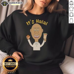 Muslim man enjoying dates kebab while wearing a 'Good It's Halal' sweatshirt during Ramadan celebration.