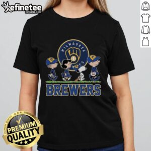 Snoopy, Charlie Brown, Linus, and Lucy in Milwaukee Brewers baseball jerseys, showcasing fun team spirit in a ladies' tee.