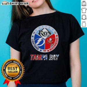 Alt Text: Top Tampa Bay Rays, Lightning, and Buccaneers logos on a ladies tee showcasing team spirit and local pride.