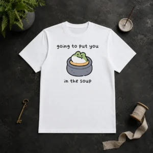 Good Frog Going To Put You In The Soup t shirt featuring a playful frog illustration on a comfortable cotton tee