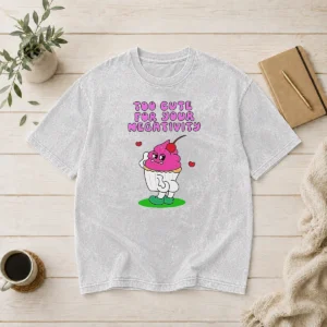 Original Too Cute For Your Negativity Sassy Cupcake on a soft washed t shirt in light gray, front view