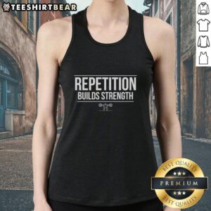 A fit person wearing a Hot Gym Repetition Builds Strength tank top, lifting weights in a vibrant gym setting.
