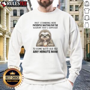Funny Grumpy Sloth Just Standing Here Patiently Waiting For The Wisdom That Is Sweatshirt on a wooden background