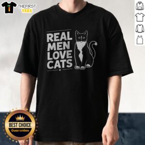 Nice Real Men Love Cats Shirt displayed on a wooden hanger against a neutral background