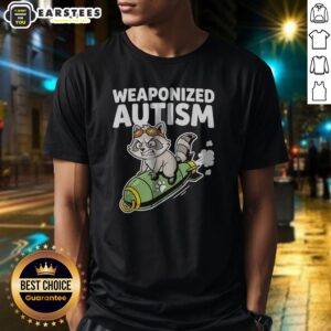 Pretty Weaponized Autism Raccoon Riding Rocket Bomb Funny Parody Humor Casual Cotton shirt displayed on a wooden background.
