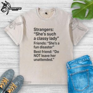 Classy lady wearing a washed t-shirt with 'She's a Fundisaster' text, showcasing friendship and style.