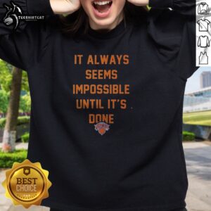 Top It Always Seems Impossible Until It Is Done New York Knicks Basketball Sweatshirt in navy blue with bold white and orange lettering