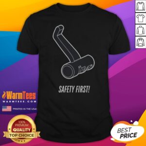 Premium Safety First shirt displayed on a wooden table with a safety-themed background