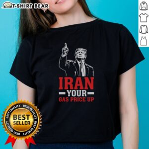 Hot Iran Your Gas Price Up Donald Trump Funny Political Ladies Shirt displayed on a wooden background.