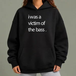 Top I Was A Victim Of The Bass Hoodie in black, featuring a bold graphic print on the front