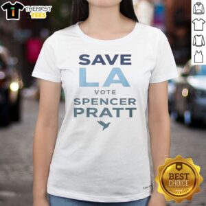 Top Save LA Vote Spencer Pratt Ladies Shirt on a wooden background, showcasing its vibrant print and comfortable fit.