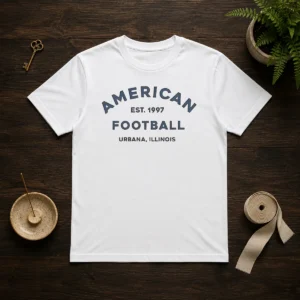 Top American Football Urbana Illinois Est 1997 T shirt in classic crew neck style with bold graphic print
