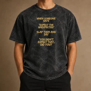 Good When Someone Says Expect The Unexpected Slap Them And Say You Didnt Expect That Did You washed t shirt in light gray with bold black text