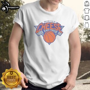 Official New York Knicks Bacon Egg N Cheese Shirt displayed on a hanger against a vibrant background.