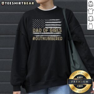 Top Dad Of Girls Outnumbered American Flag Sweatshirt featuring a patriotic design