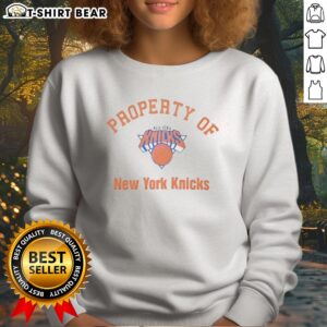 Awesome New York Knicks NBA Property Of New York Knicks Logo Sweatshirt featuring vibrant team colors and logo.