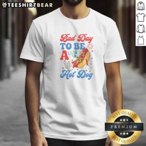 Top Bad Day To Be A Hot Dog Funny 4th Of July Summer Shirt displayed on a flat lay background.