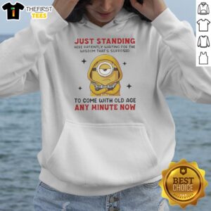 Awesome Minion Just Standing Here Patiently Waiting For The Wisdom That'S Supposed To Come With Old Age Hoodie displayed on a hanger