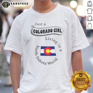 Awesome Just A Colorado Girl Living In A North Dakota World shirt displayed on a wooden background