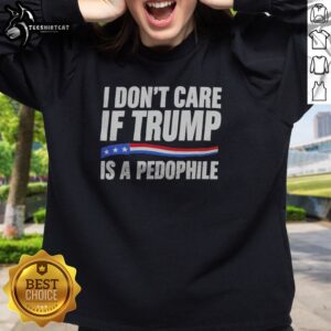 Funny I Don'T Care If Trump Is A Pedophjle Sweatshirt displayed in a cozy setting.