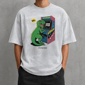 Good Asteroids Game Over Dinosaur Funny Washed T Shirt featuring a retro dinosaur arcade game design on a soft washed fabric