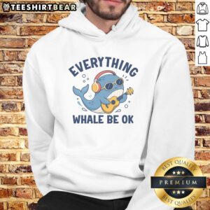 Official Everything Whale Be OK Hoodie displayed on a wooden background, showcasing its vibrant design and cozy fit.