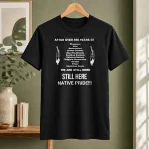 Funny After Over 500 Years Of We Are Still Here Still Here Native Pride t shirt in black, front view with bold white text design