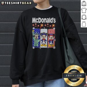 Hot Mcdonalds Mickey Mouse As Statue Of Liberty And Uncle Sam Patriotic Sweatshirt featuring bold patriotic graphic on cozy fabric