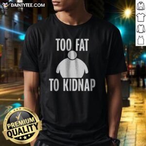 Funny Too Fat To Kidnap Shirt displayed on a wooden background, showcasing its playful design.