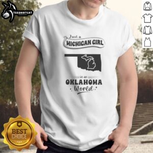 Good Just A Michigan Girl In An Oklahoma World graphic t-shirt with bold white text on black cotton fabric